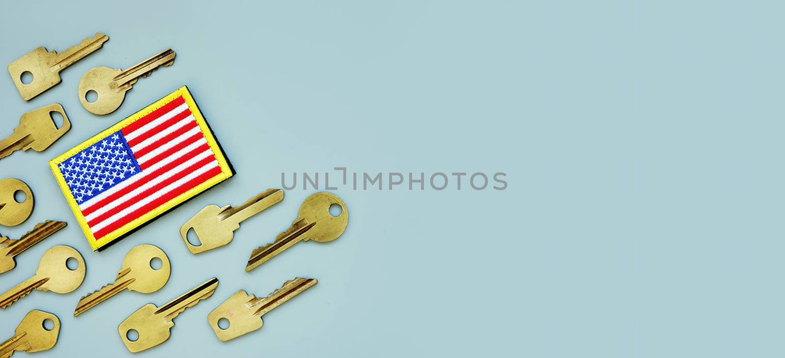 American flag and keys on a gray background. VA mortgage or Department of Veterans Affairs home loan. by designer491