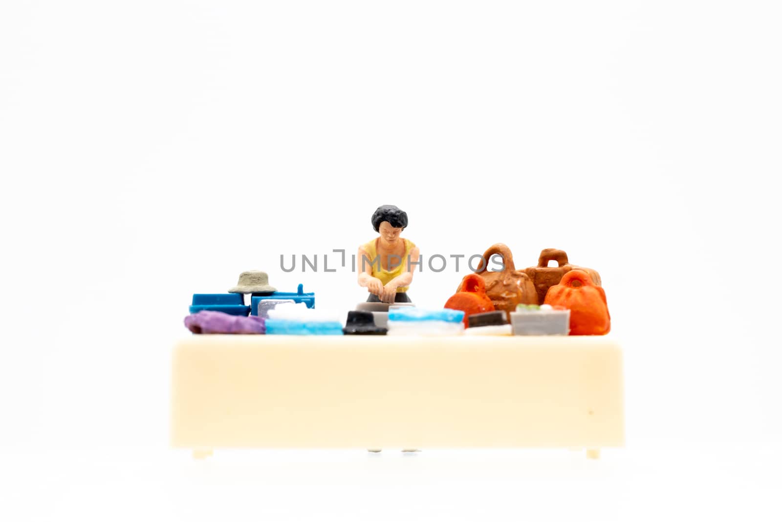 Miniature people standing on white background and space for text