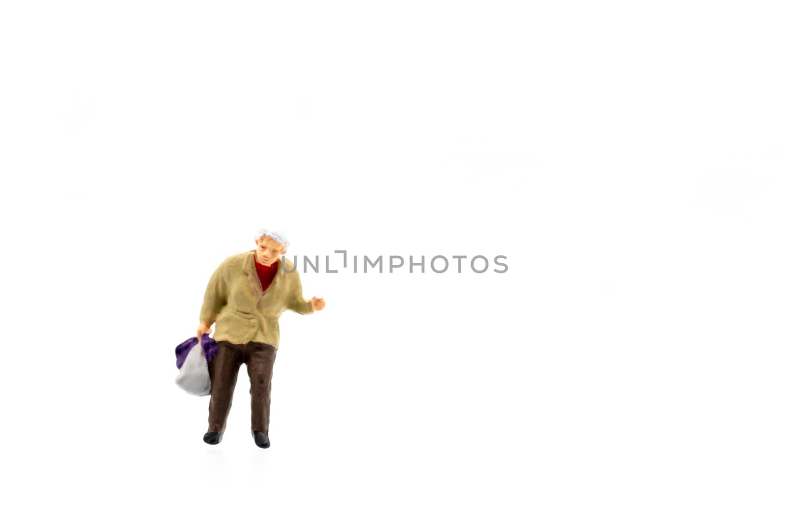 Miniature people standing on white background and space for text