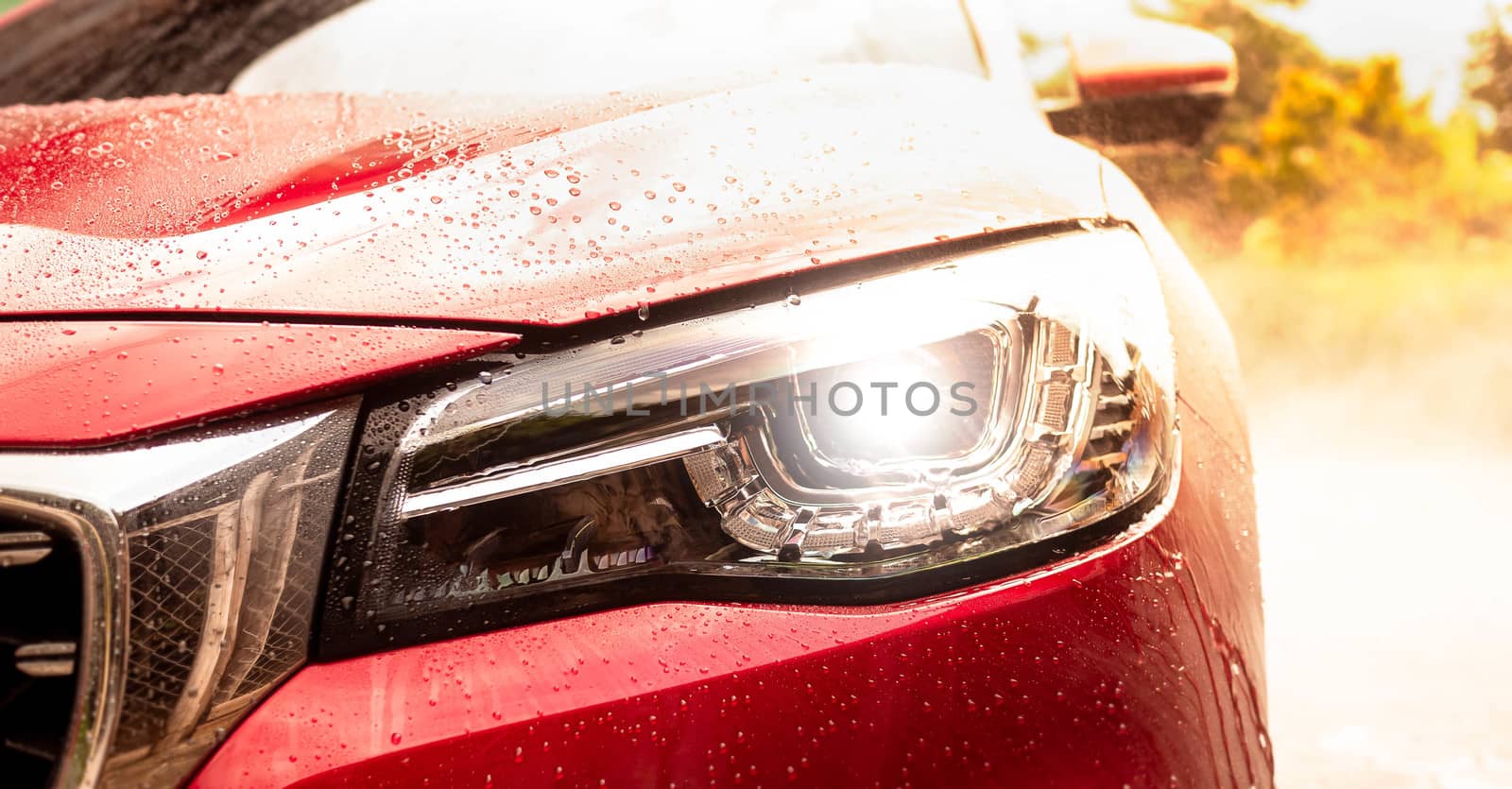 Close-up of front headlight lamp of modern car.