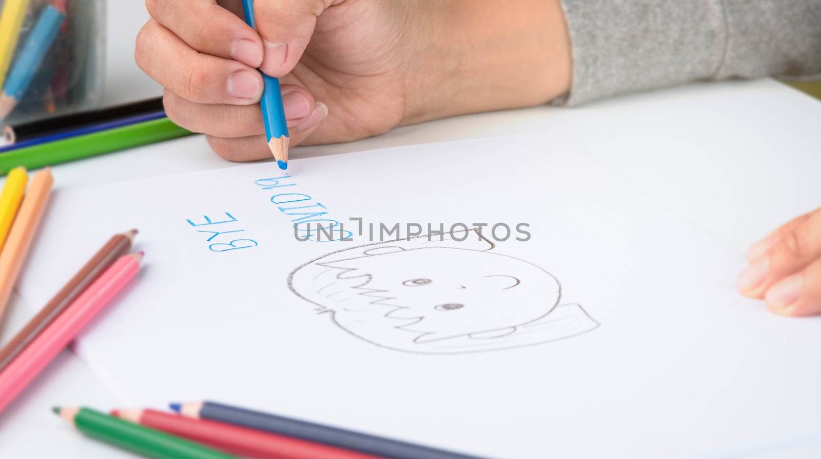 Close-up of a hand painted with color pencil, depiction of smiling girl showing goodbye to the Coronavirus.