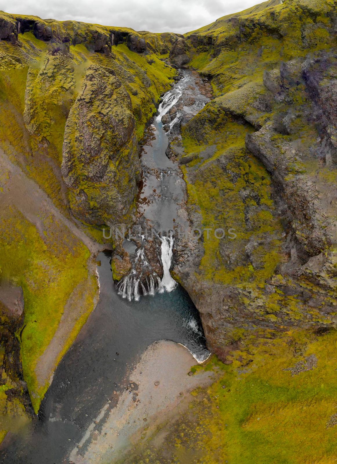 Vertical aerial view of Stjornarfoss Waterfalls in Iceland, summer season.