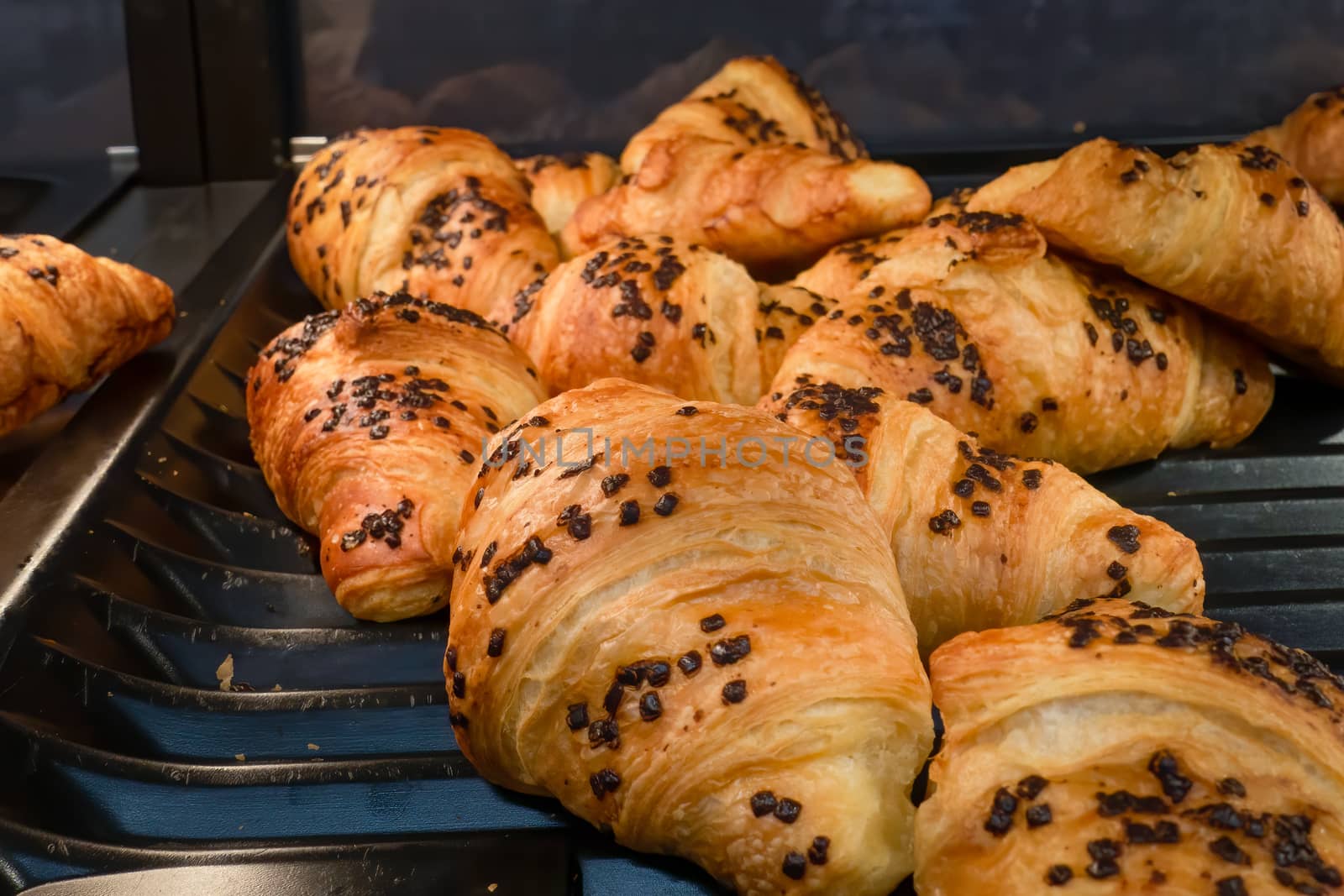 Freshly baked chocolate croissants by magicbones