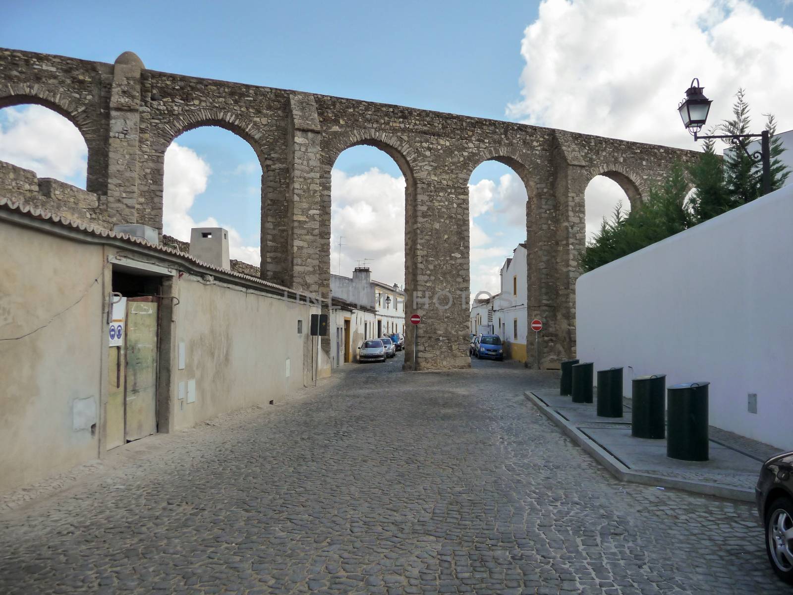 street view on the Aqueduto da agua de Prata in Evora, Portugal. Aqueduct of Silver Water. by kb79