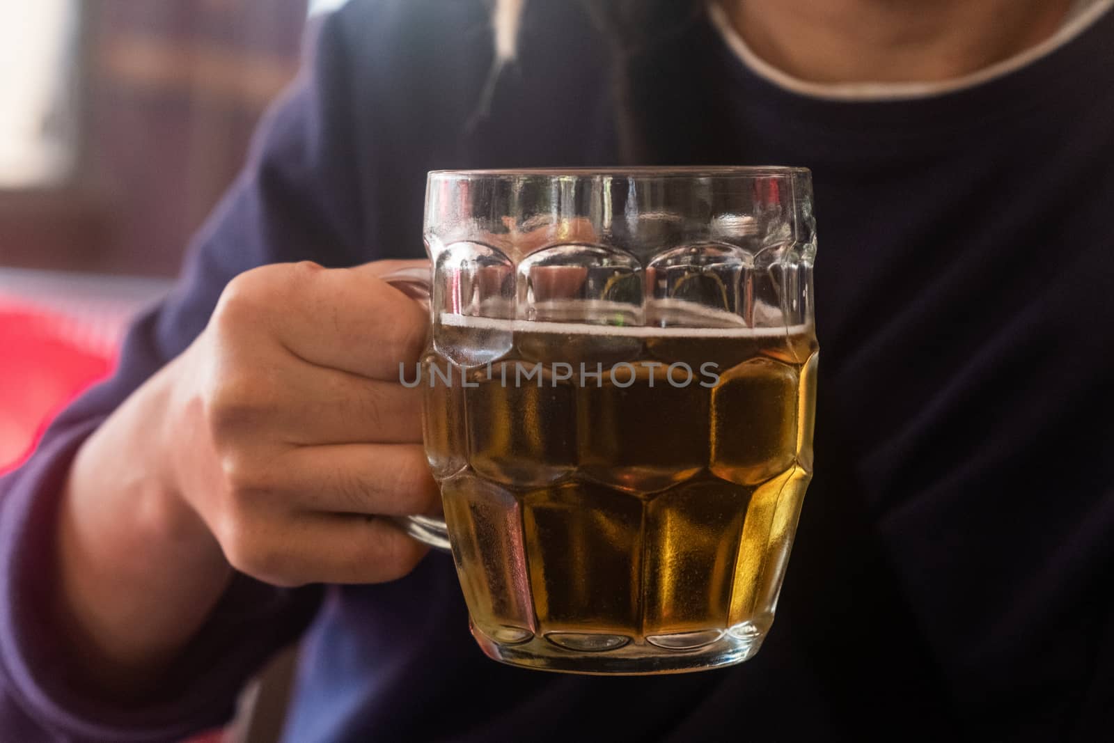 Man drinking traditional pint of real ale beer.