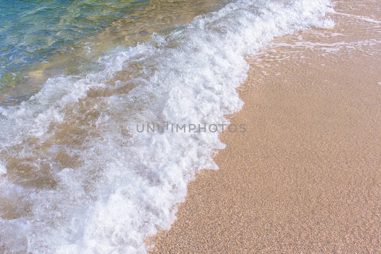 Wave of sea on the beach. Beautiful ocean wave on sandy beach.