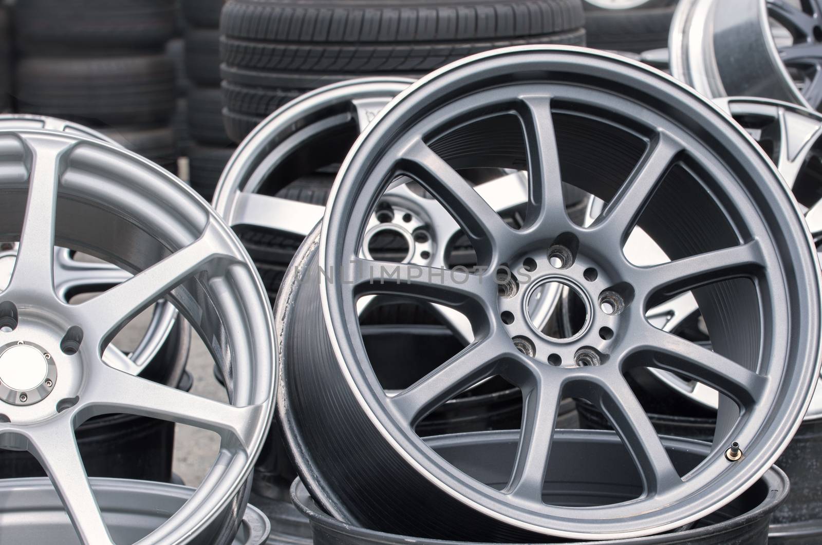 Wheel rims on showcase. Car alloy wheels at a wheel shop