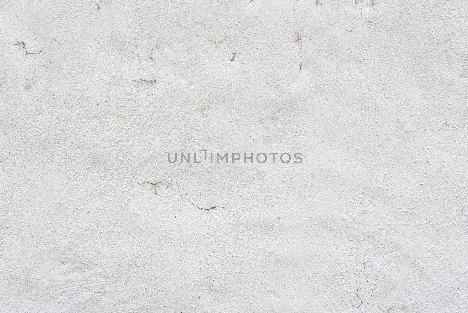 White plaster on the wall. Old painted wall