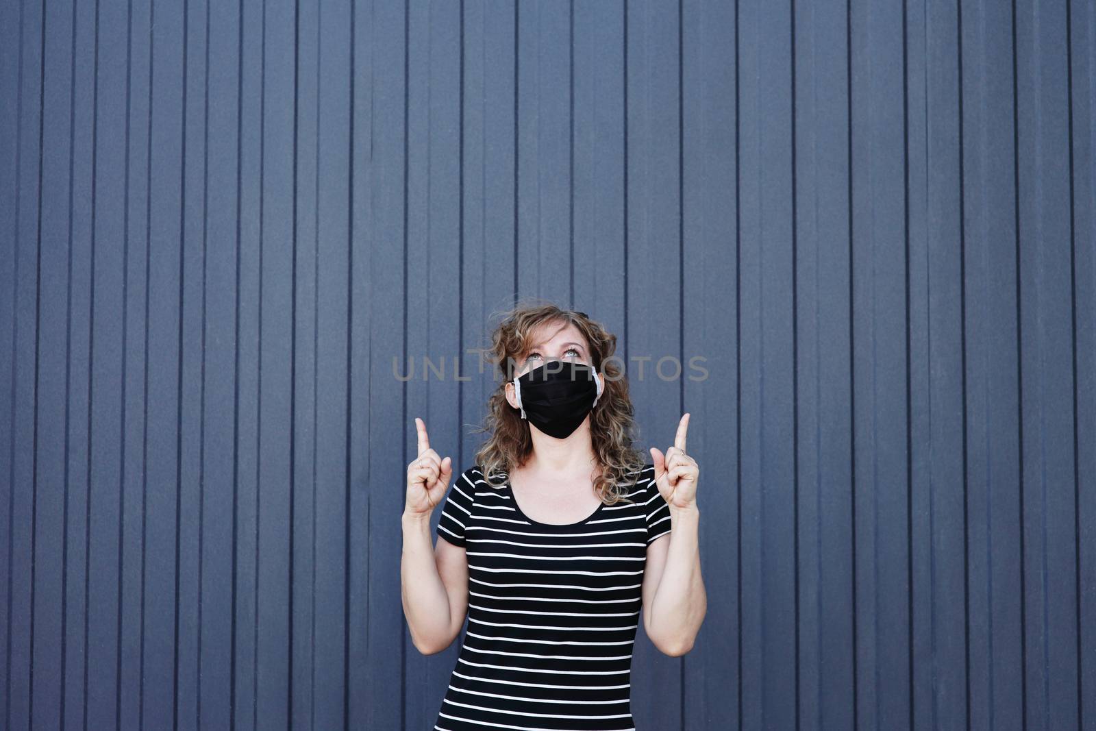 Portrait of a Girl in a protective mask free space for an inscription. by selinsmo