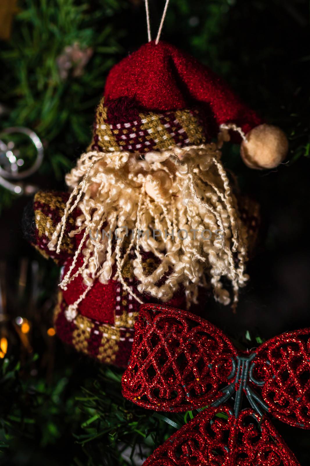 Christmas hanging decorations on fir tree. Decorated Christmas tree. Fir branch with Christmas baubles decorations.