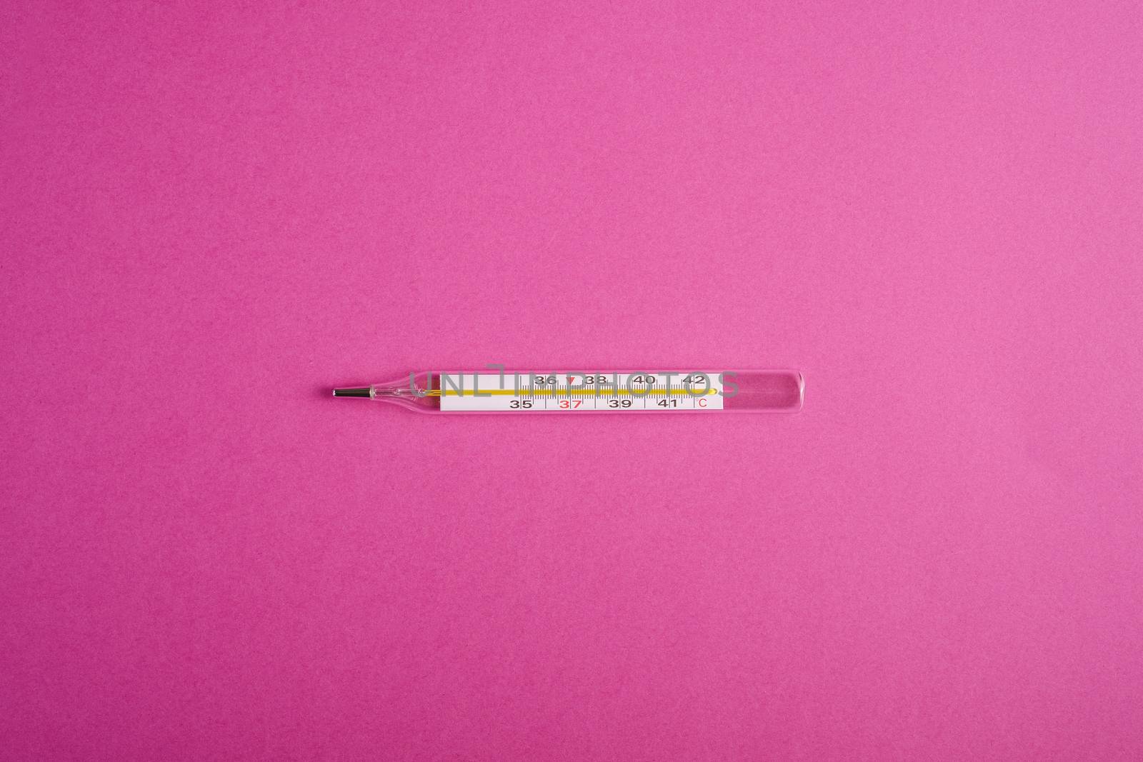 Analog thermometer on pink purple background, healthcare medical concept, antibiotics and cure, top view copy space