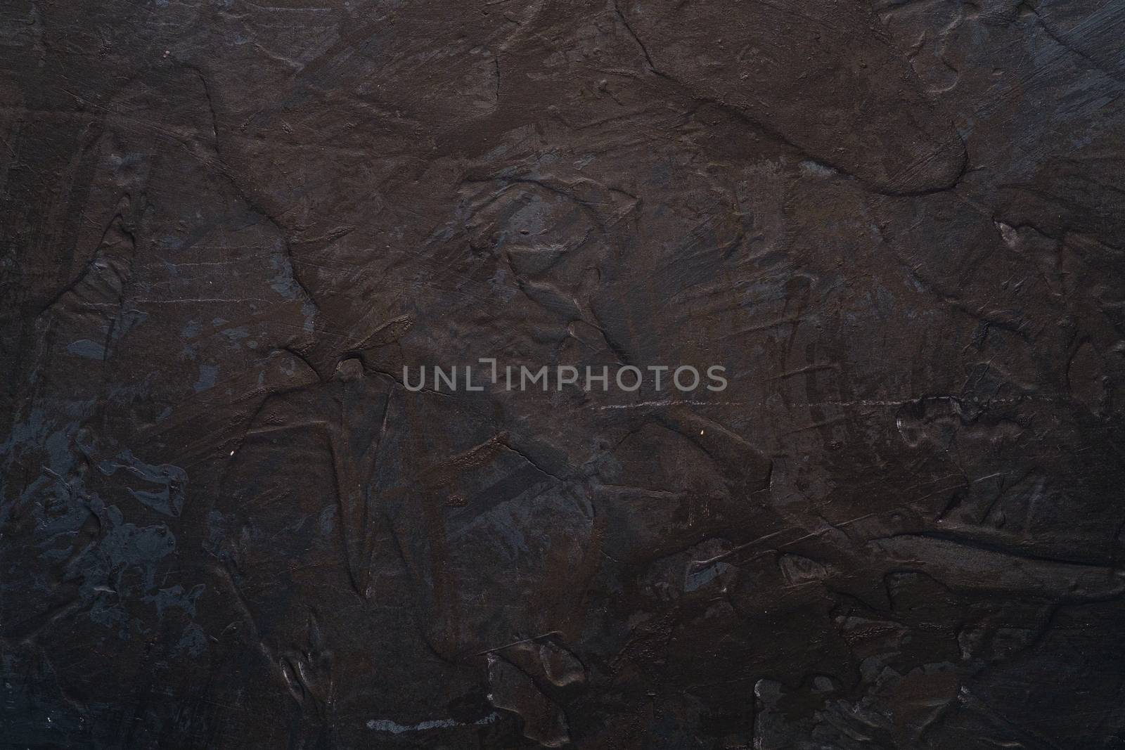 Photo of creative dark textured background in black, brown and blue grunge colors, paint and splash drops backdrop