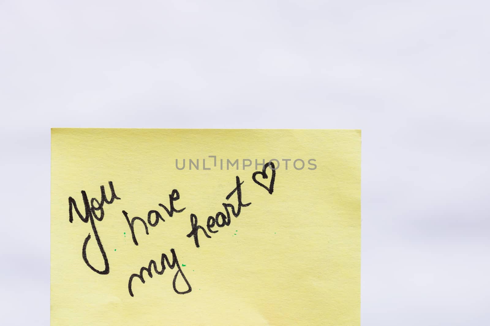 You have my heart handwriting text close up isolated on yellow paper with copy space.