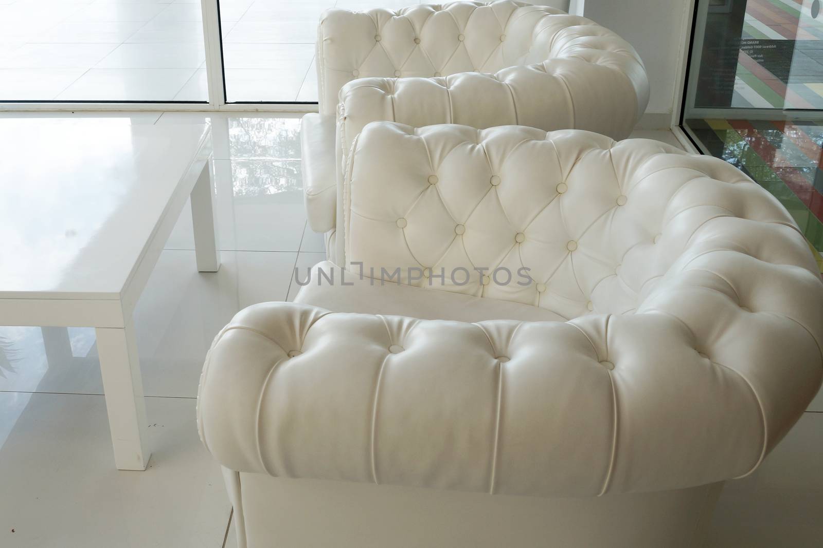 white leather armchairs in a white interior by Annado
