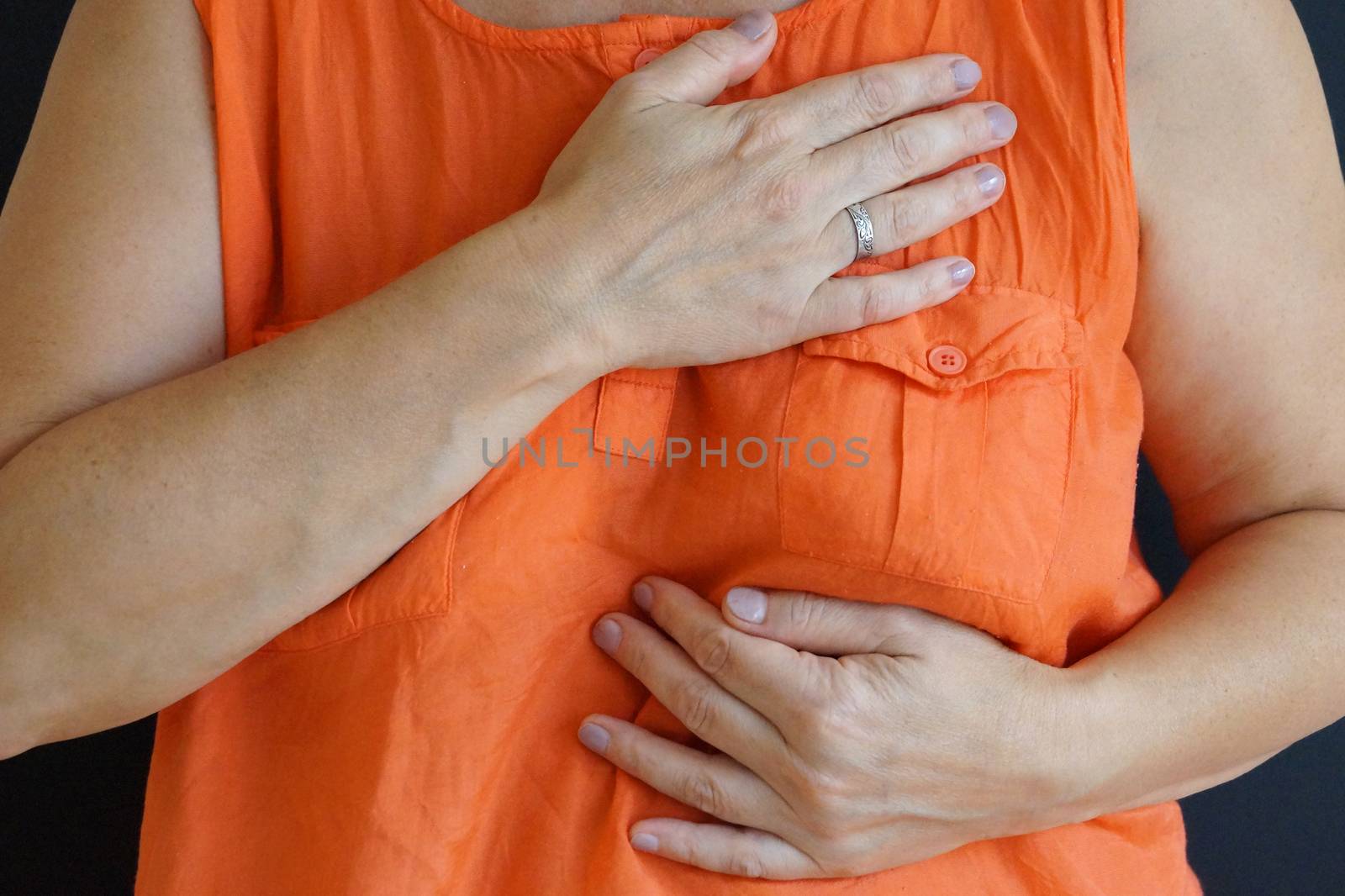 woman holding a sick heart close up by Annado