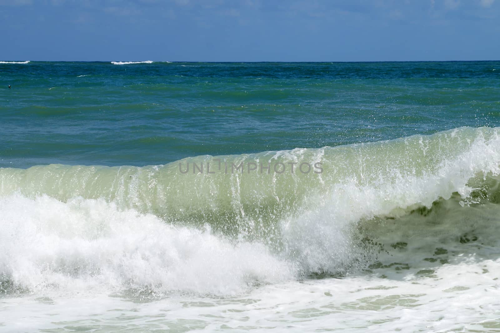 big white waves hitting the sea shore by Annado