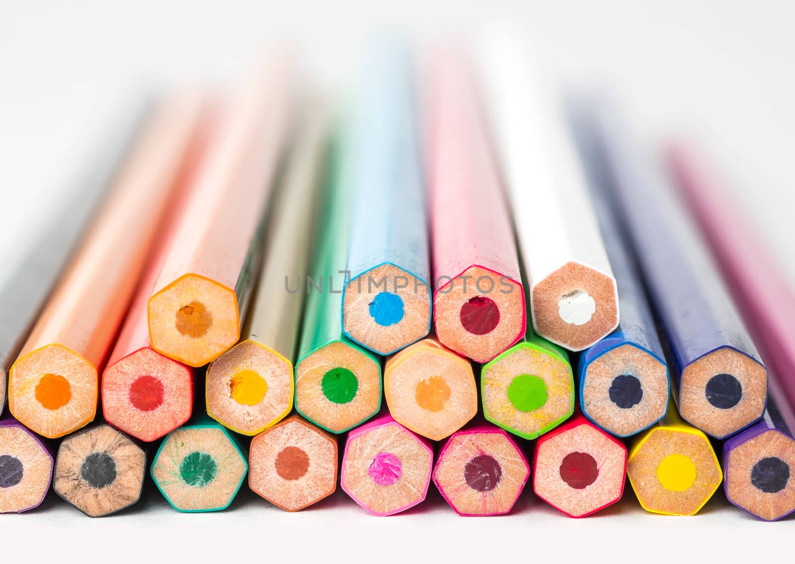 Back view of stacked colored pencils.Close up.