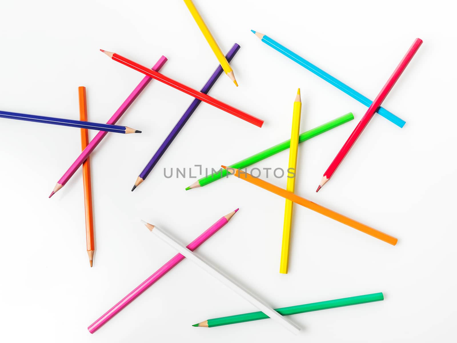 Color pencils on white background. Back to school concept- Top view.