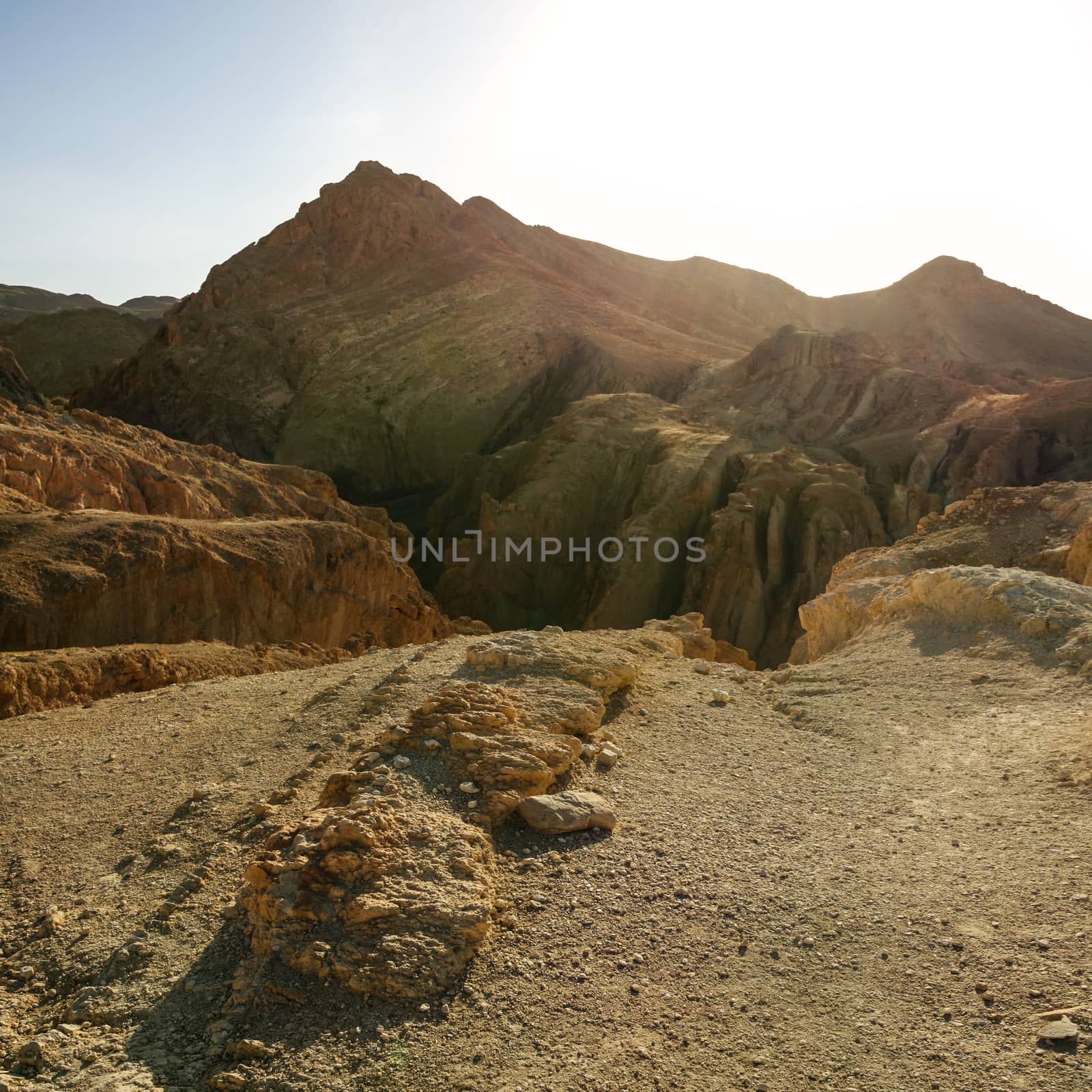 Atlas mountains near Chebika in strong sun back light. by Ivanko