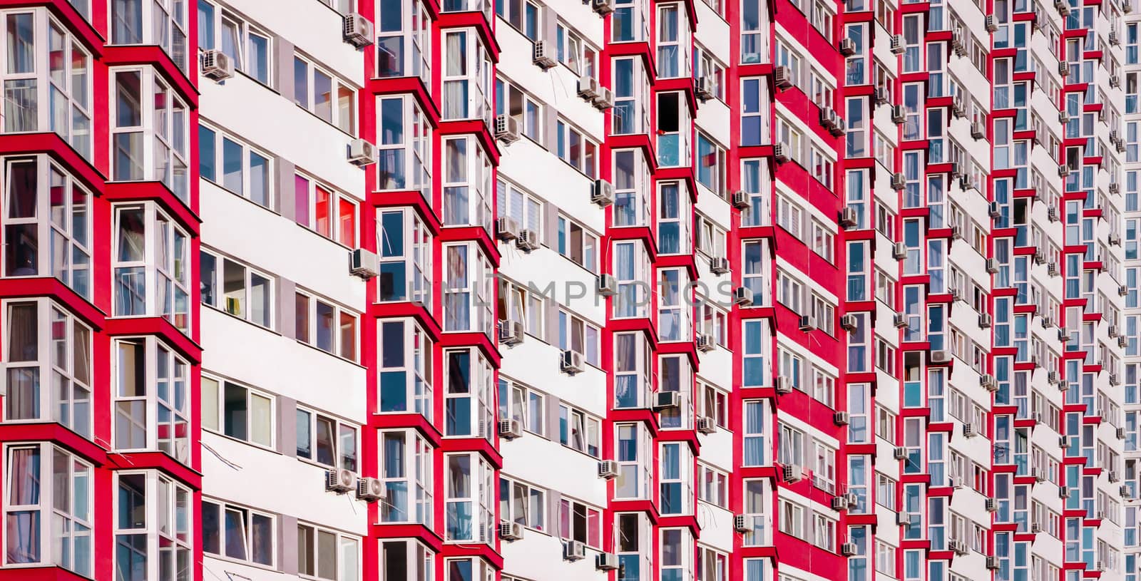 Part of Modern residential apartment with flat building exterior. Detail of new house and home complex. Fragment of city real estate property and condo architecture. Real estate market