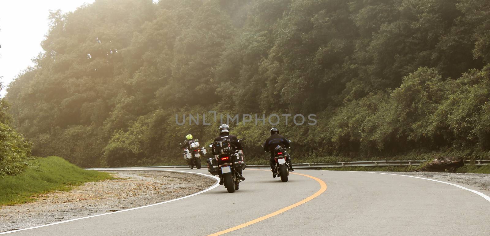 Three bikers riding big bike motorcycle touring on Inthanon National Park, Thailand.