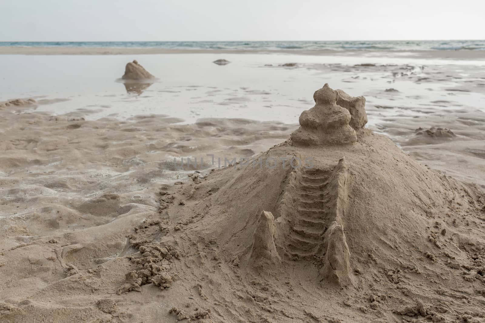 Temple of sand on the beach. Like a sandcastle. Bentota Beach in Sri Lanka.