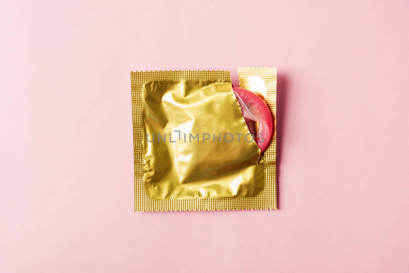 condom in wrapper pack is tear open by Sorapop