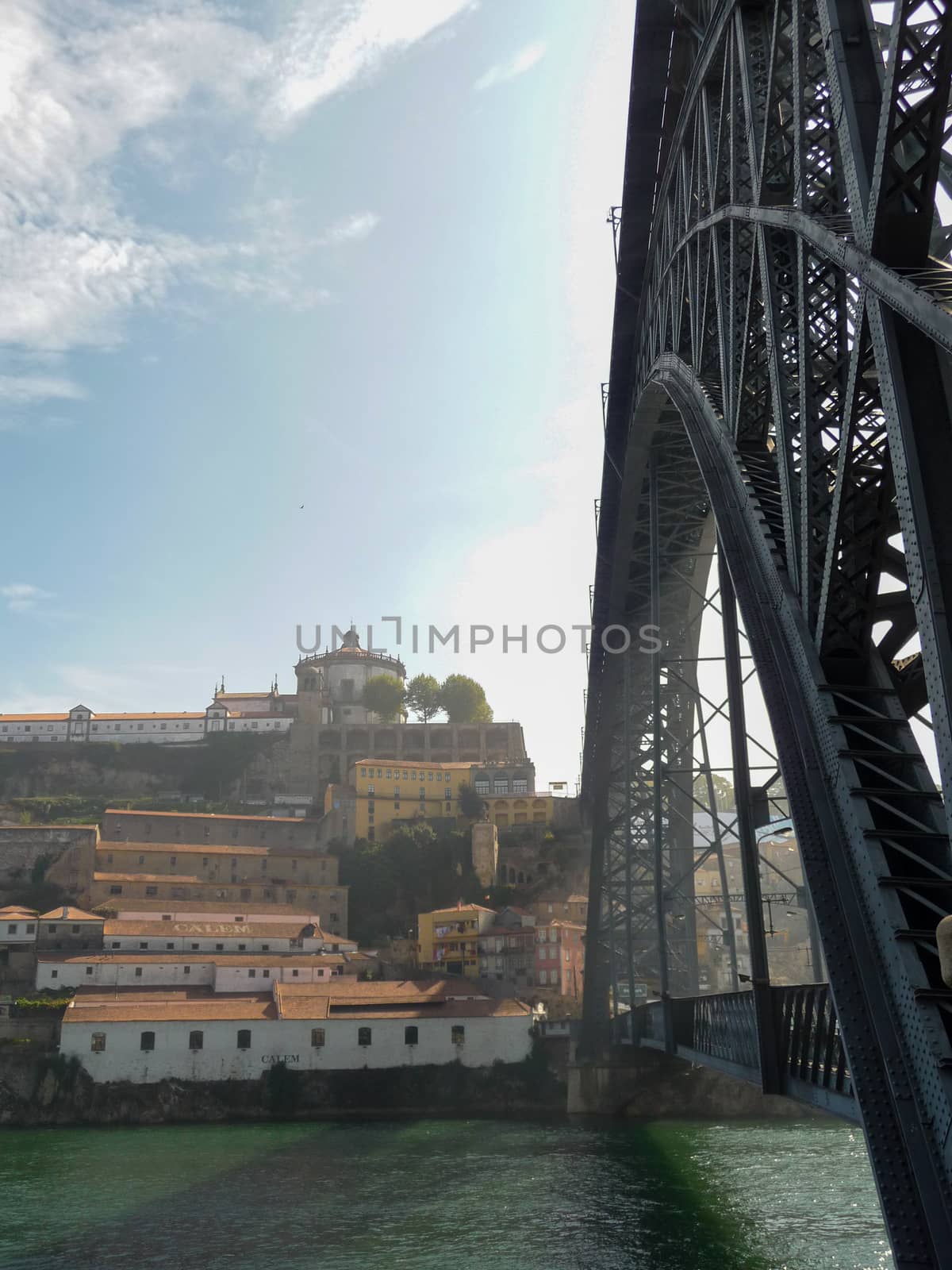 Vertical side view on famous Dom Luis I Bridge over river Douro on Porto, Portugal by kb79