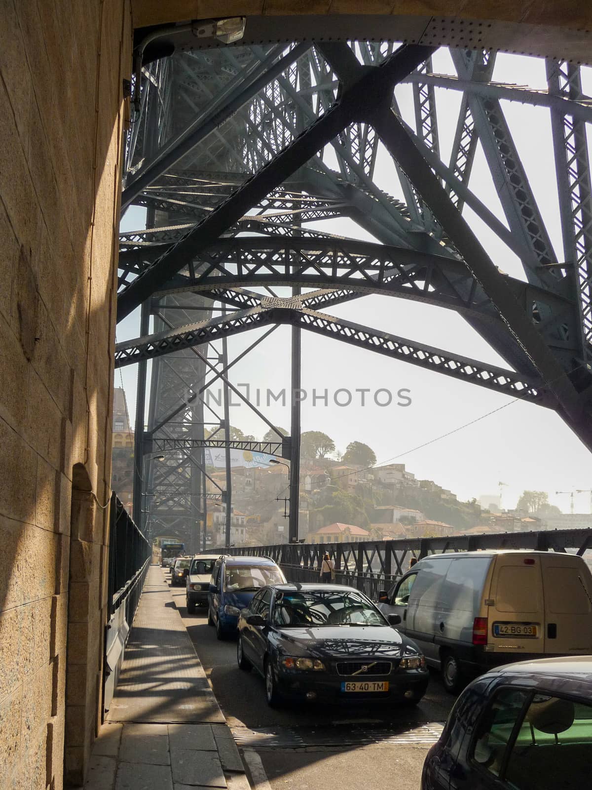 Porto, Portugal, October 2010: Traffic on the famous Dom Luis I Bridge over river Douro on Porto, Portugal during rush hour.