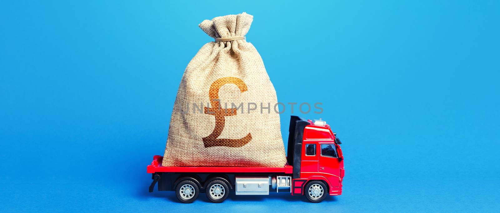Truck is carrying a huge british pound sterling money bag. Great investment. Anti-crisis measures of government. Attracting large funds to the economy for subsidies, support soft loans for businesses by iLixe48