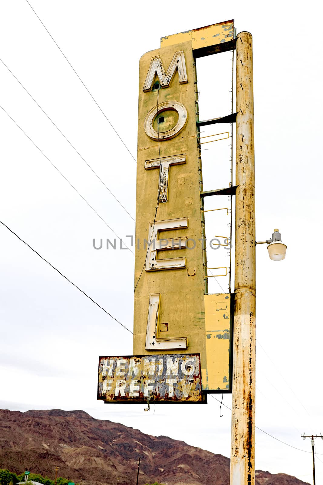 Old Motel sign ruin along historic Route 66 in the middle of California vast Mojave desert. by USA-TARO