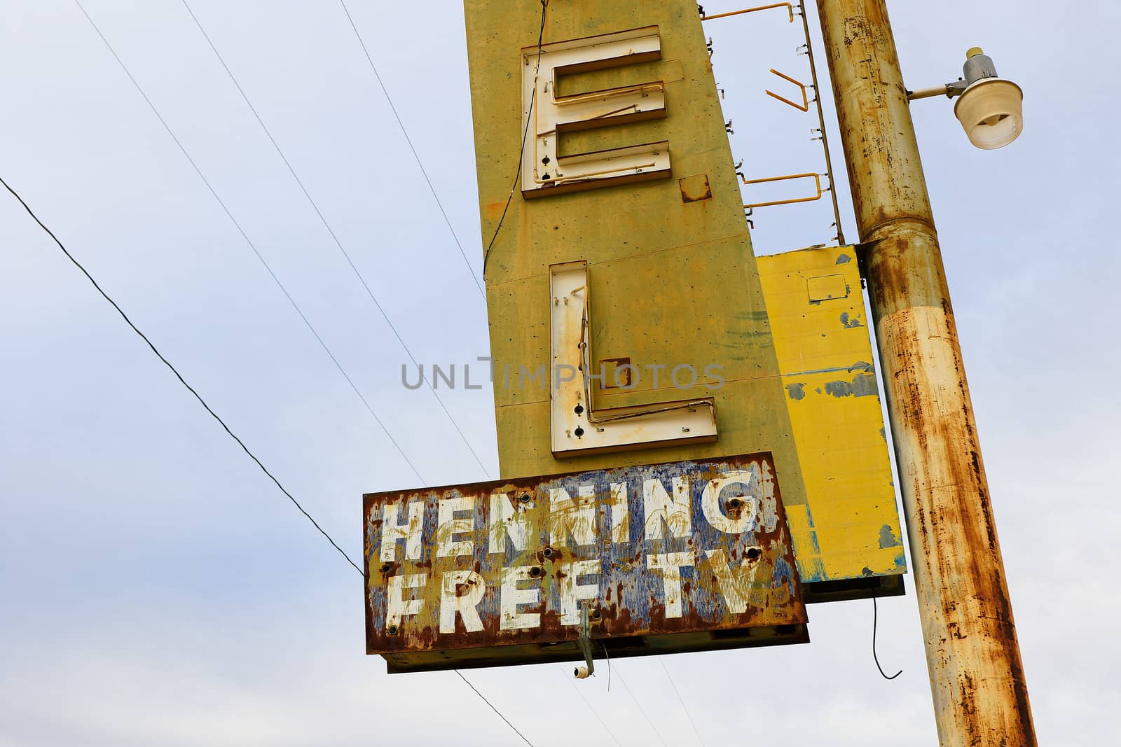 Old Motel sign ruin along historic Route 66 in the middle of California vast Mojave desert. by USA-TARO