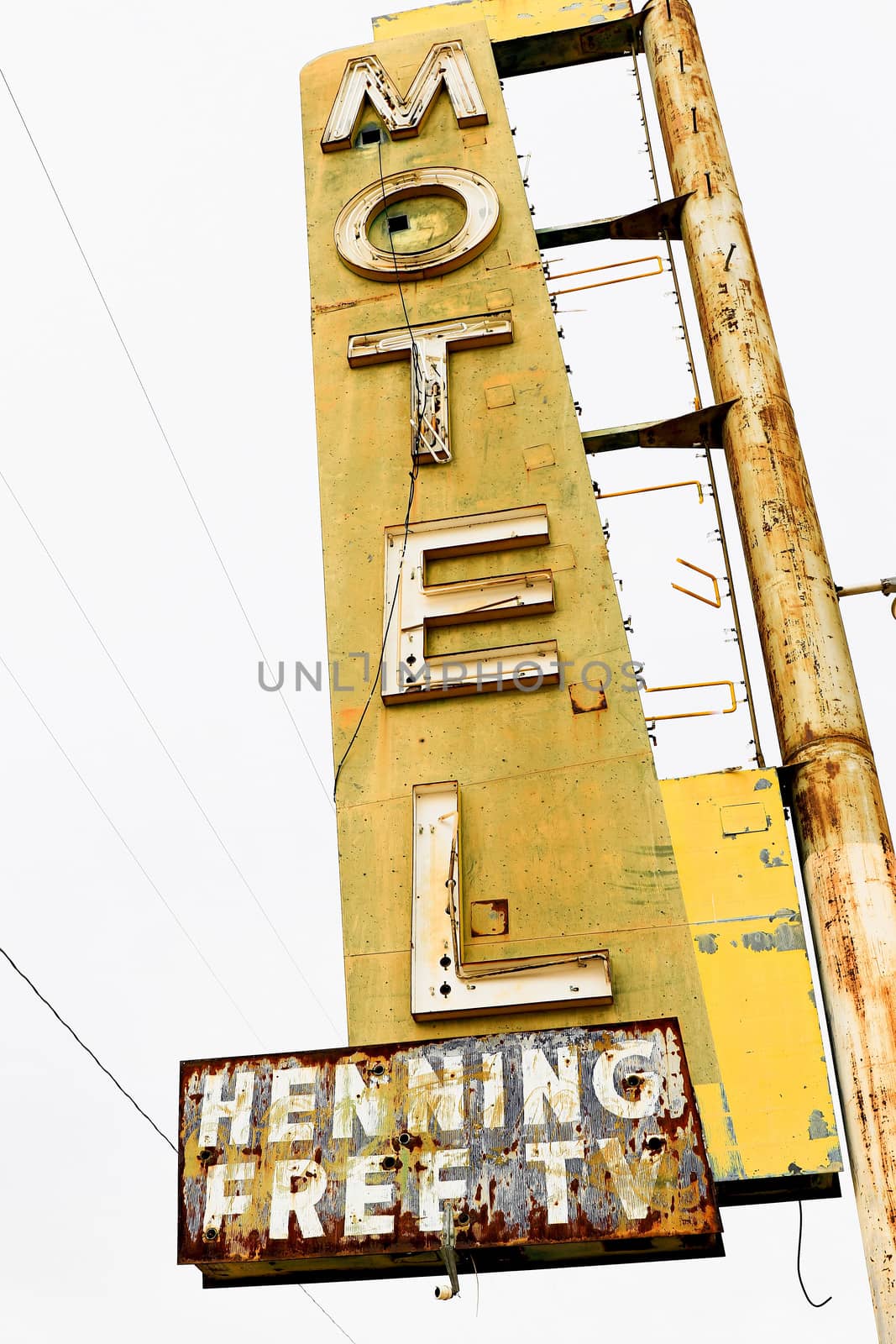 Old Motel sign ruin along historic Route 66 in the middle of California vast Mojave desert.