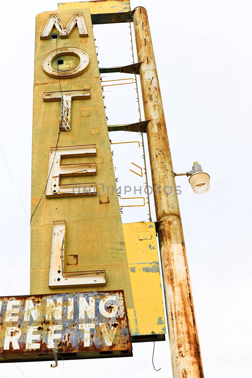 Old Motel sign ruin along historic Route 66 in the middle of California vast Mojave desert. by USA-TARO