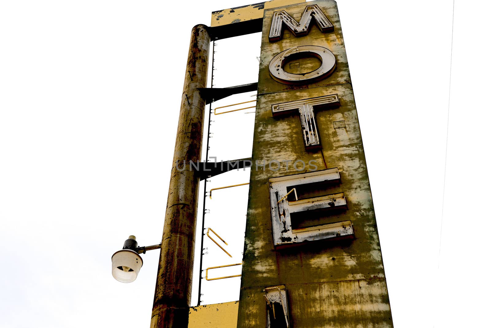 Old Motel sign ruin along historic Route 66 in the middle of California vast Mojave desert.