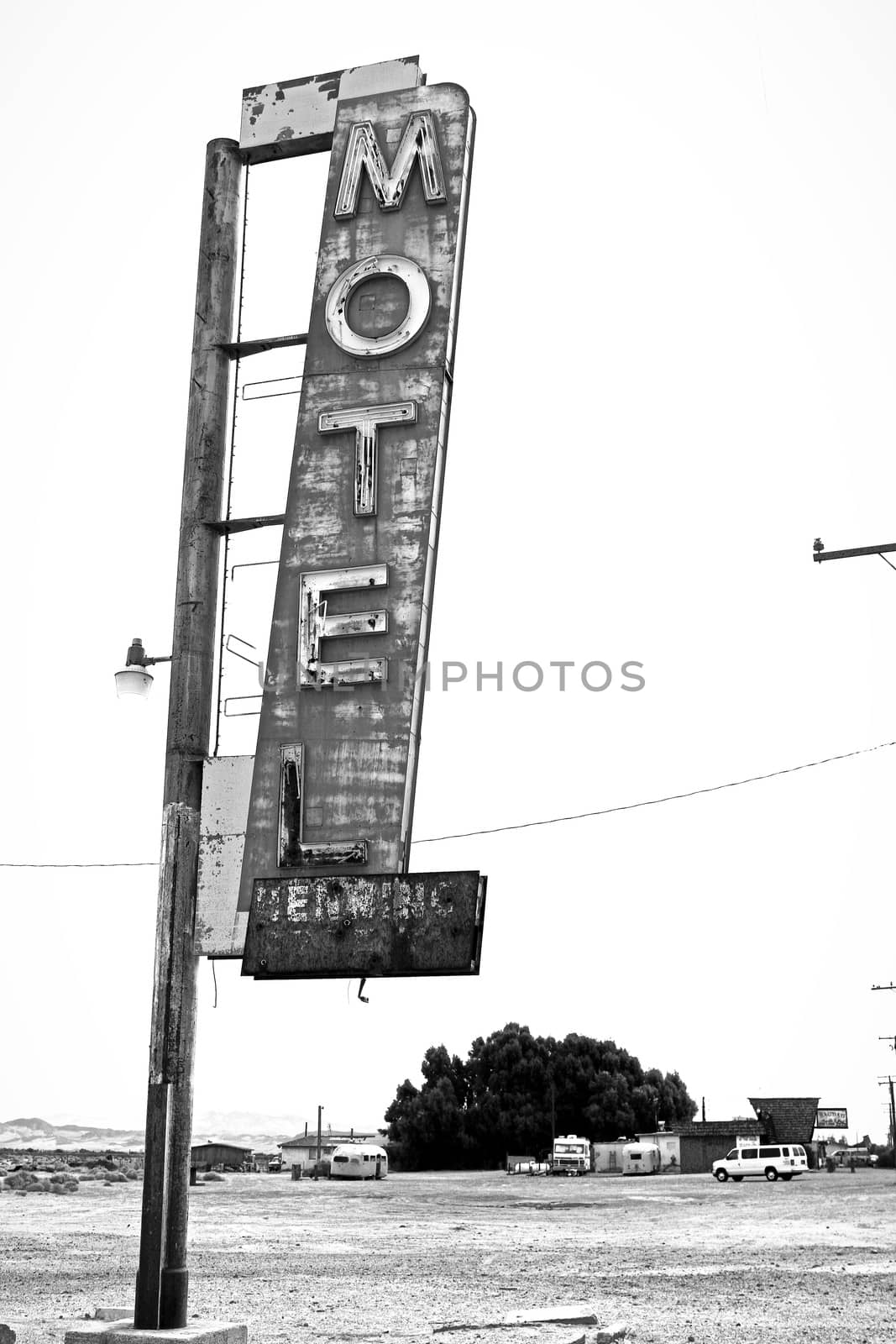 Old Motel sign ruin along historic Route 66 in the middle of California vast Mojave desert. by USA-TARO