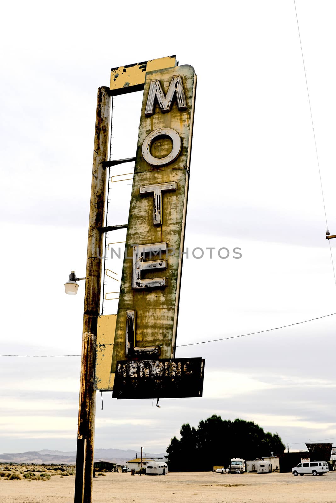 Old Motel sign ruin along historic Route 66 in the middle of California vast Mojave desert. by USA-TARO