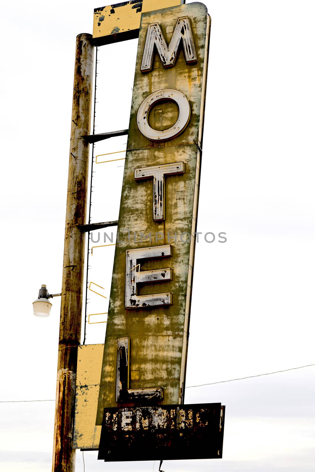 Old Motel sign ruin along historic Route 66 in the middle of California vast Mojave desert.