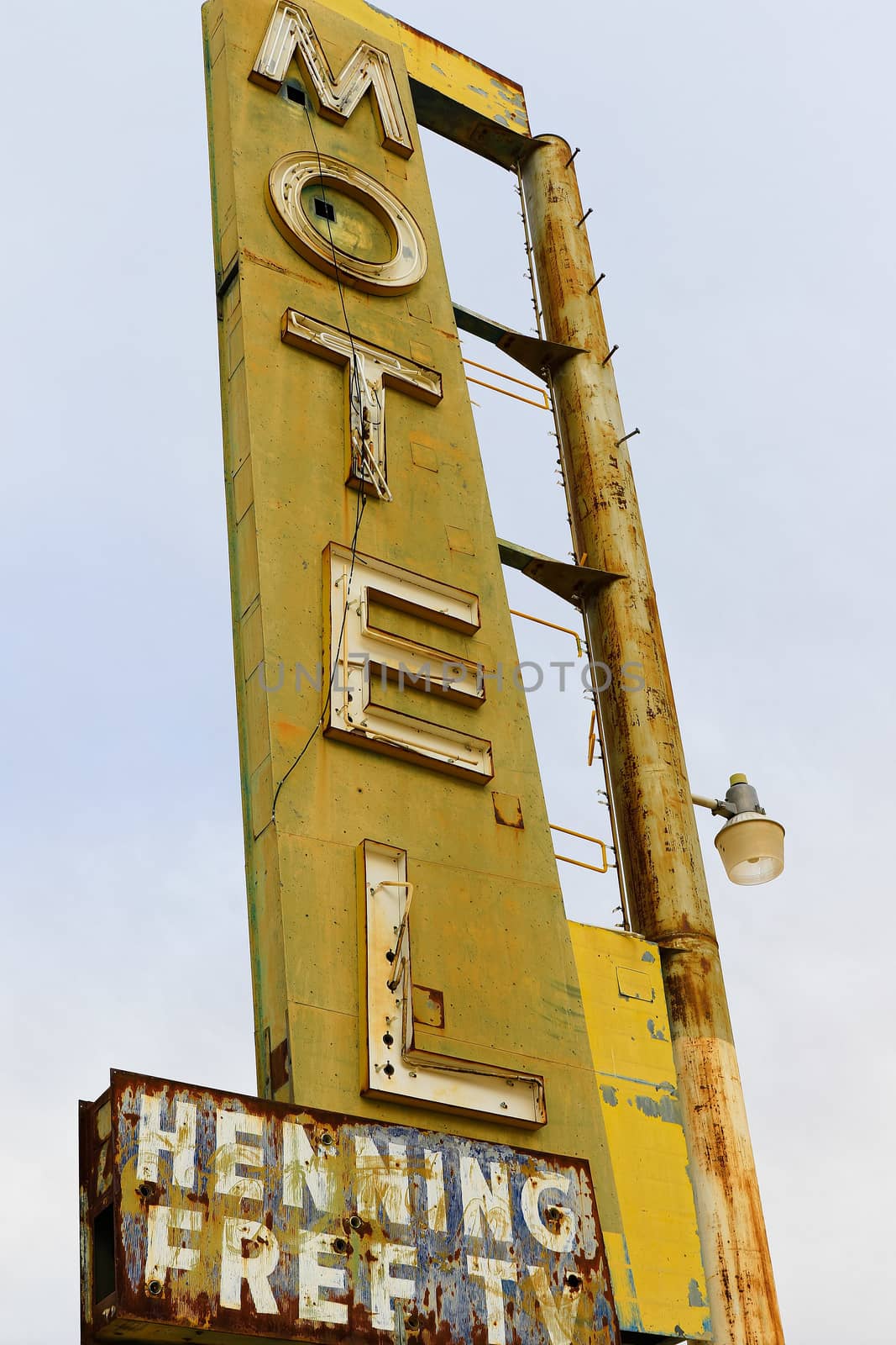 Old Motel sign ruin along historic Route 66 in the middle of California vast Mojave desert. by USA-TARO