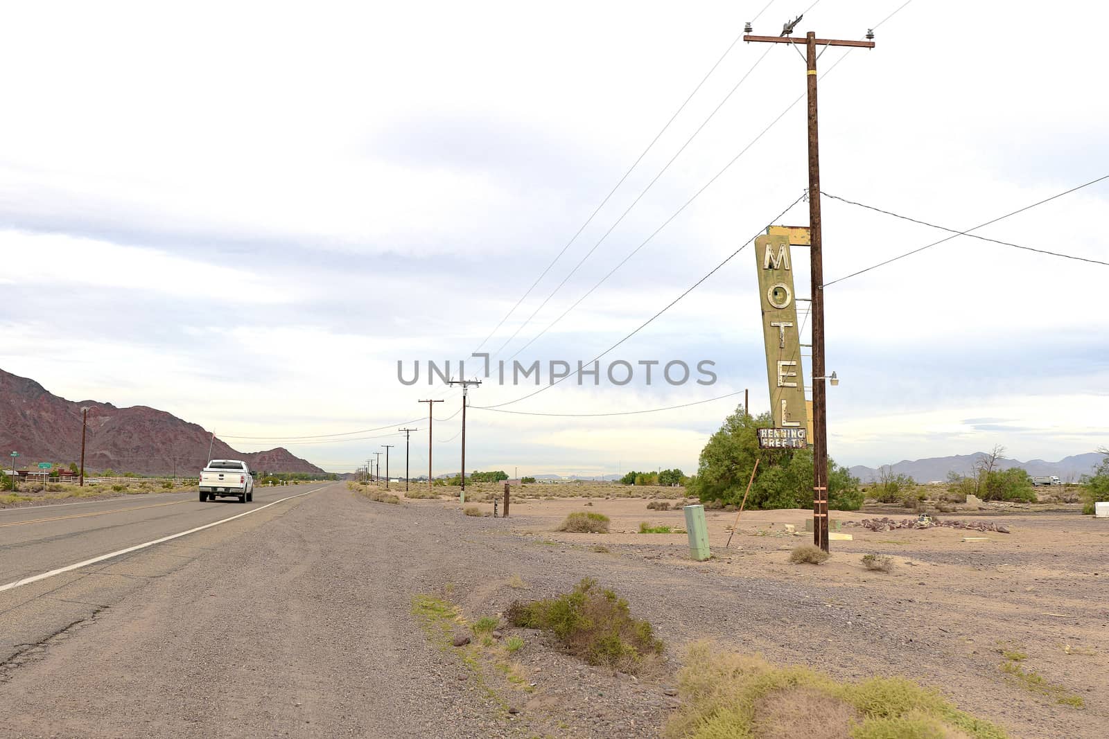 Old Motel sign ruin along historic Route 66 in the middle of California vast Mojave desert. by USA-TARO