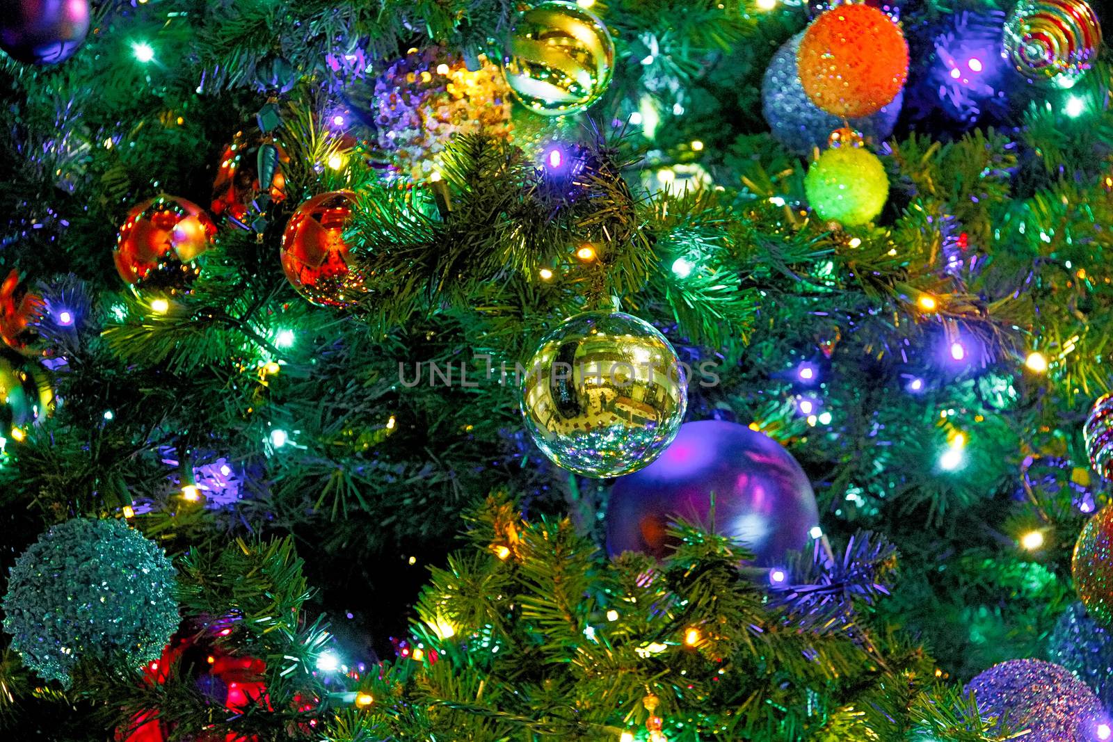 Many colorful ornaments on Christmas tree.Merry Christmas and Happy Holidays. A beautiful living room decorated for Christmas.festively decorated home interior with Christmas tree.beautiful ornaments by USA-TARO