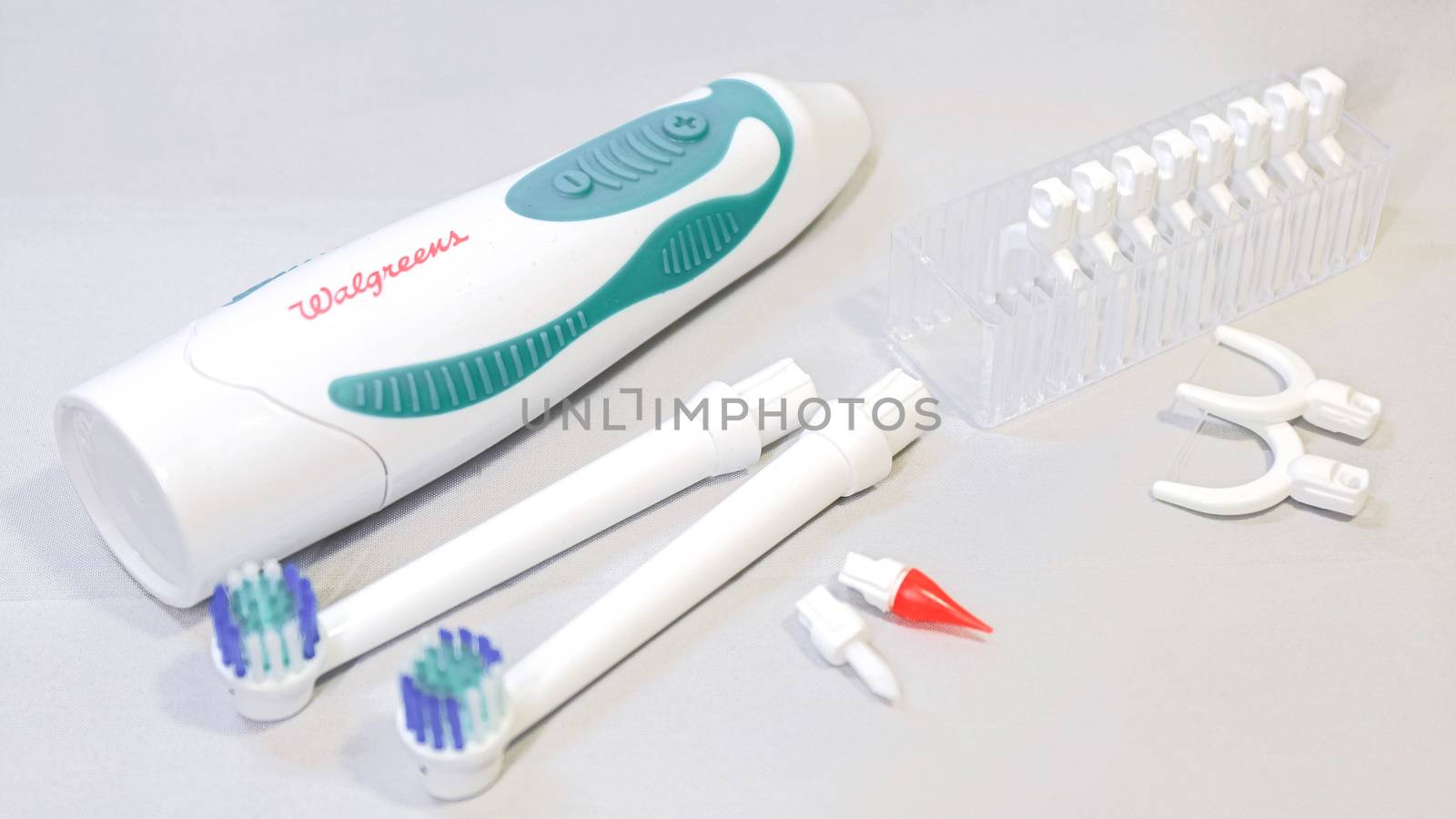 Electronic toothbrush with toothbrush heads white color background by USA-TARO
