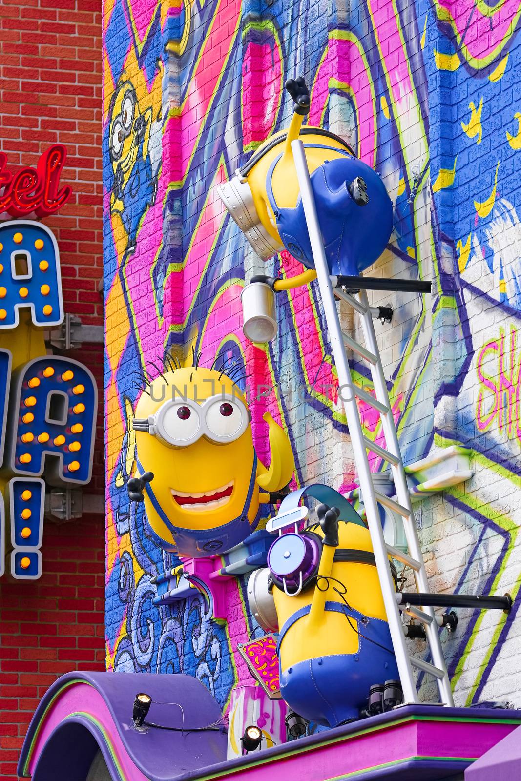 OSAKA, JAPAN - June 24, 2017 : Statue of "HAPPY MINION", located in Universal Studios Japan, Osaka, Japan. Minions are famous character from Despicable Me animation_A