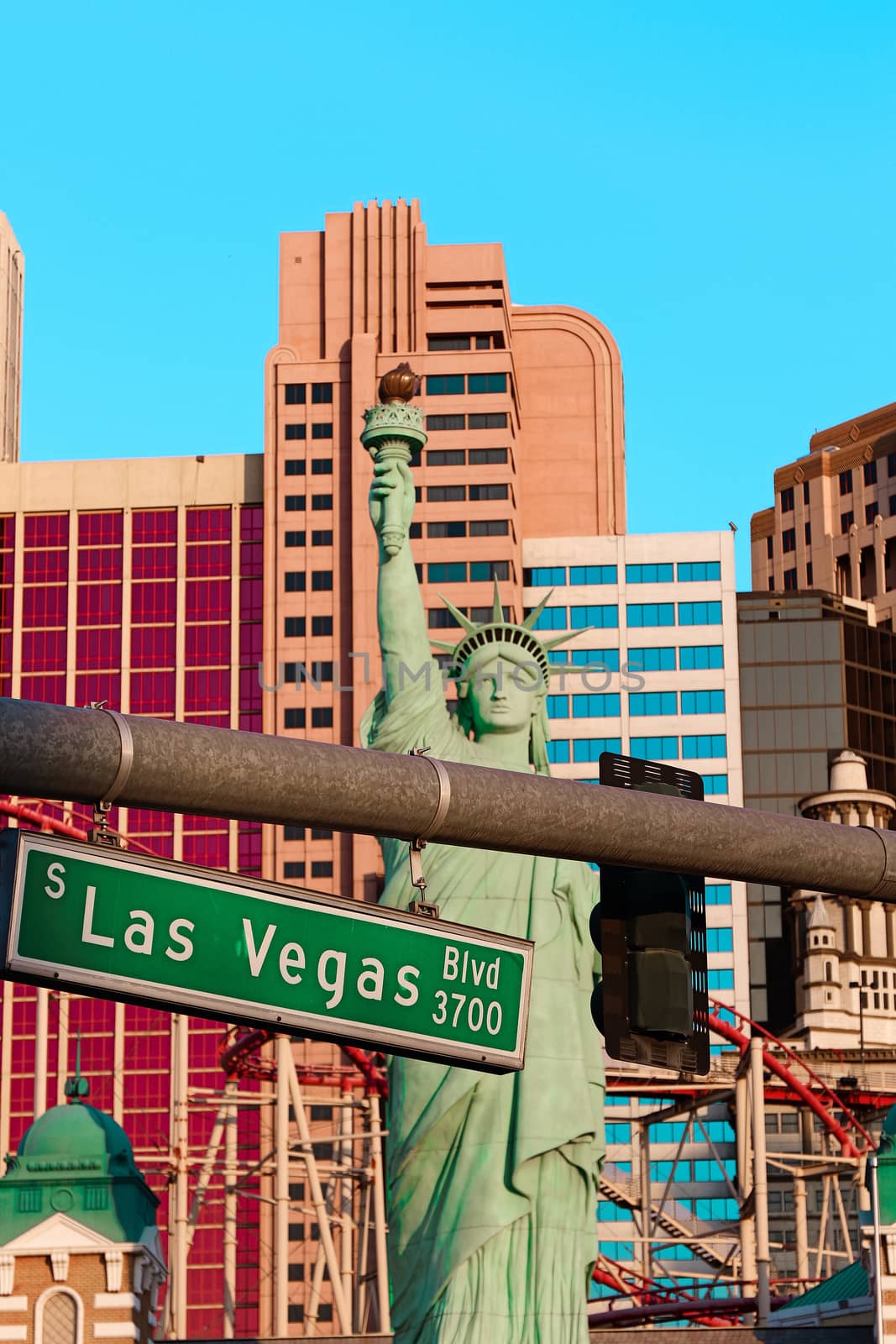 Road sign of Las Vegas BLVD.Street sign of Las vegas Boulevard.Green Las Vegas Sign with Hotel in Background. by USA-TARO