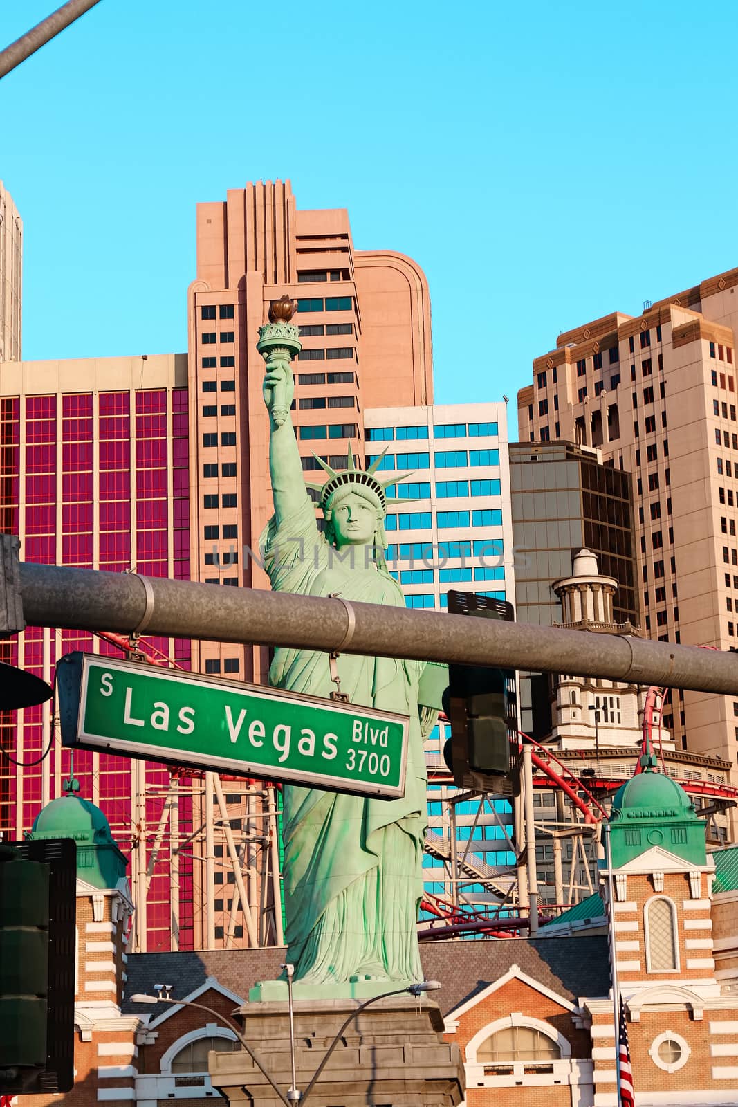 Road sign of Las Vegas BLVD.Street sign of Las vegas Boulevard.Green Las Vegas Sign with Hotel in Background. by USA-TARO