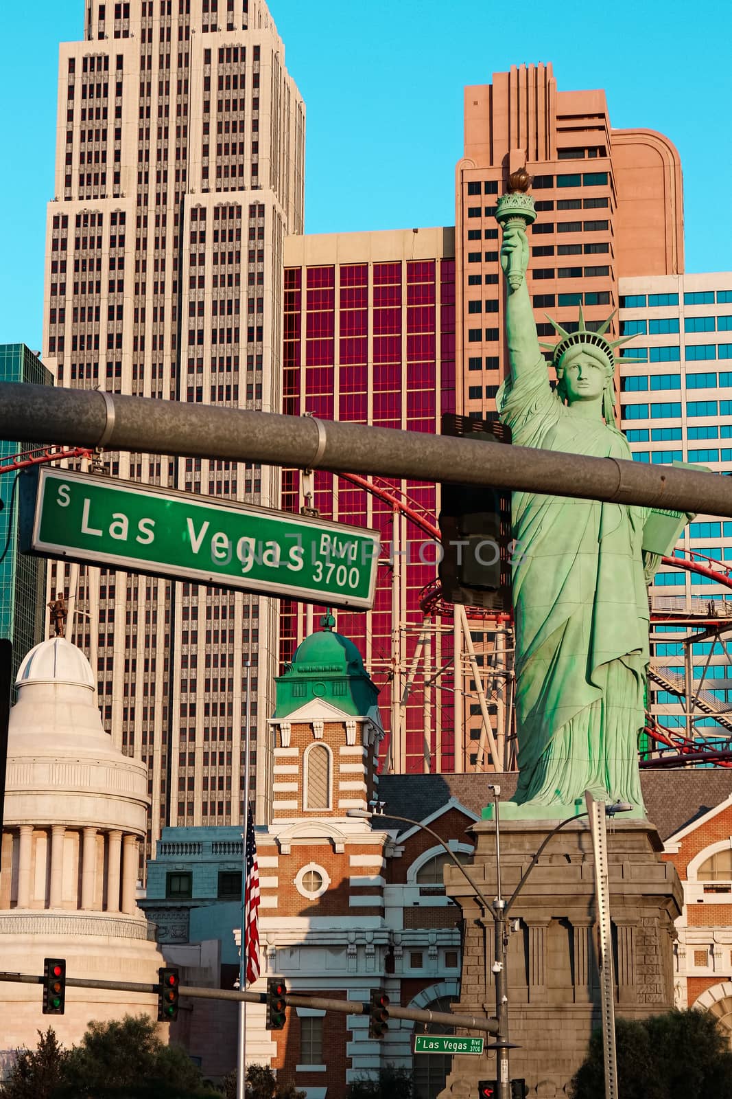 Road sign of Las Vegas BLVD.Street sign of Las vegas Boulevard.Green Las Vegas Sign with Hotel in Background. by USA-TARO