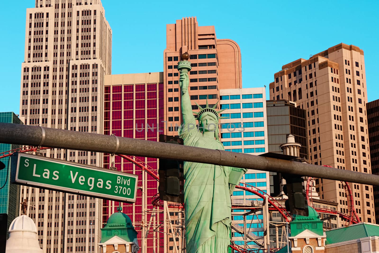 Road sign of Las Vegas BLVD.Street sign of Las vegas Boulevard.Green Las Vegas Sign with Hotel in Background. by USA-TARO