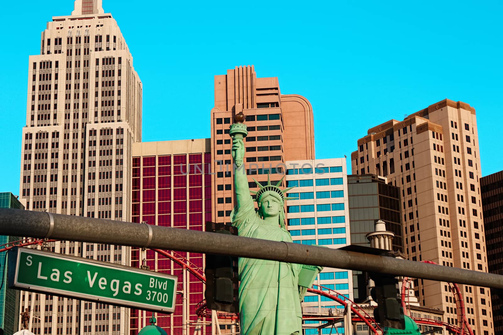 Road sign of Las Vegas BLVD.Street sign of Las vegas Boulevard.Green Las Vegas Sign with Hotel in Background. by USA-TARO