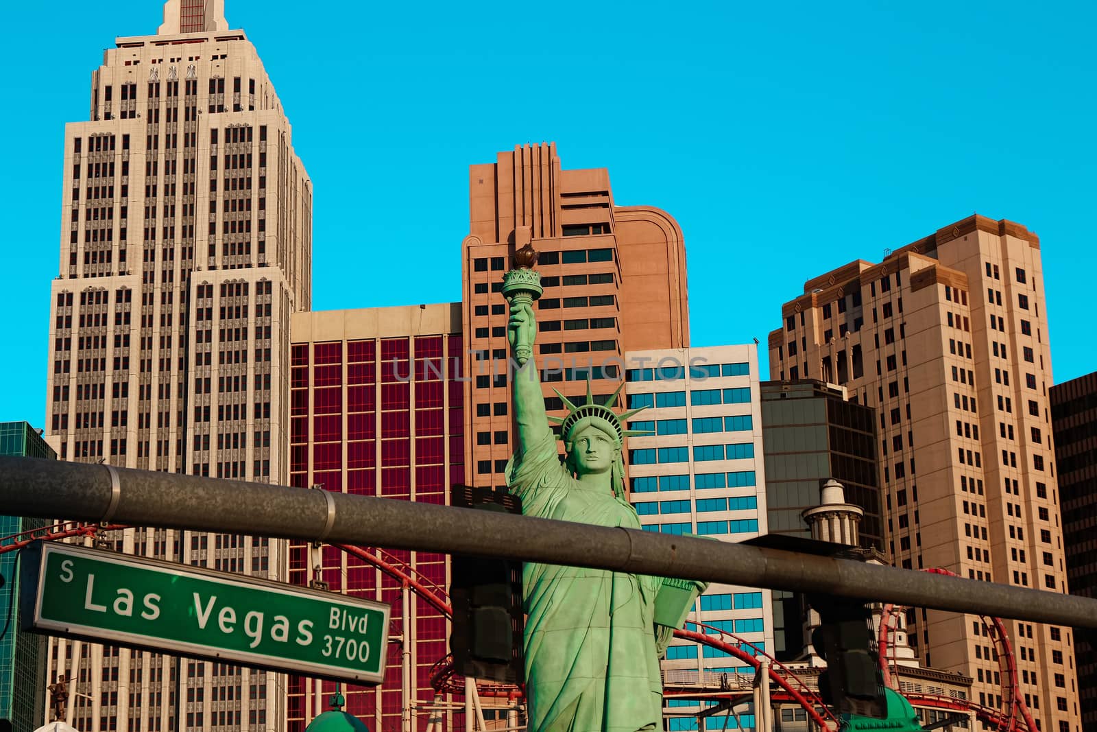 Road sign of Las Vegas BLVD.Street sign of Las vegas Boulevard.Green Las Vegas Sign with Hotel in Background. by USA-TARO