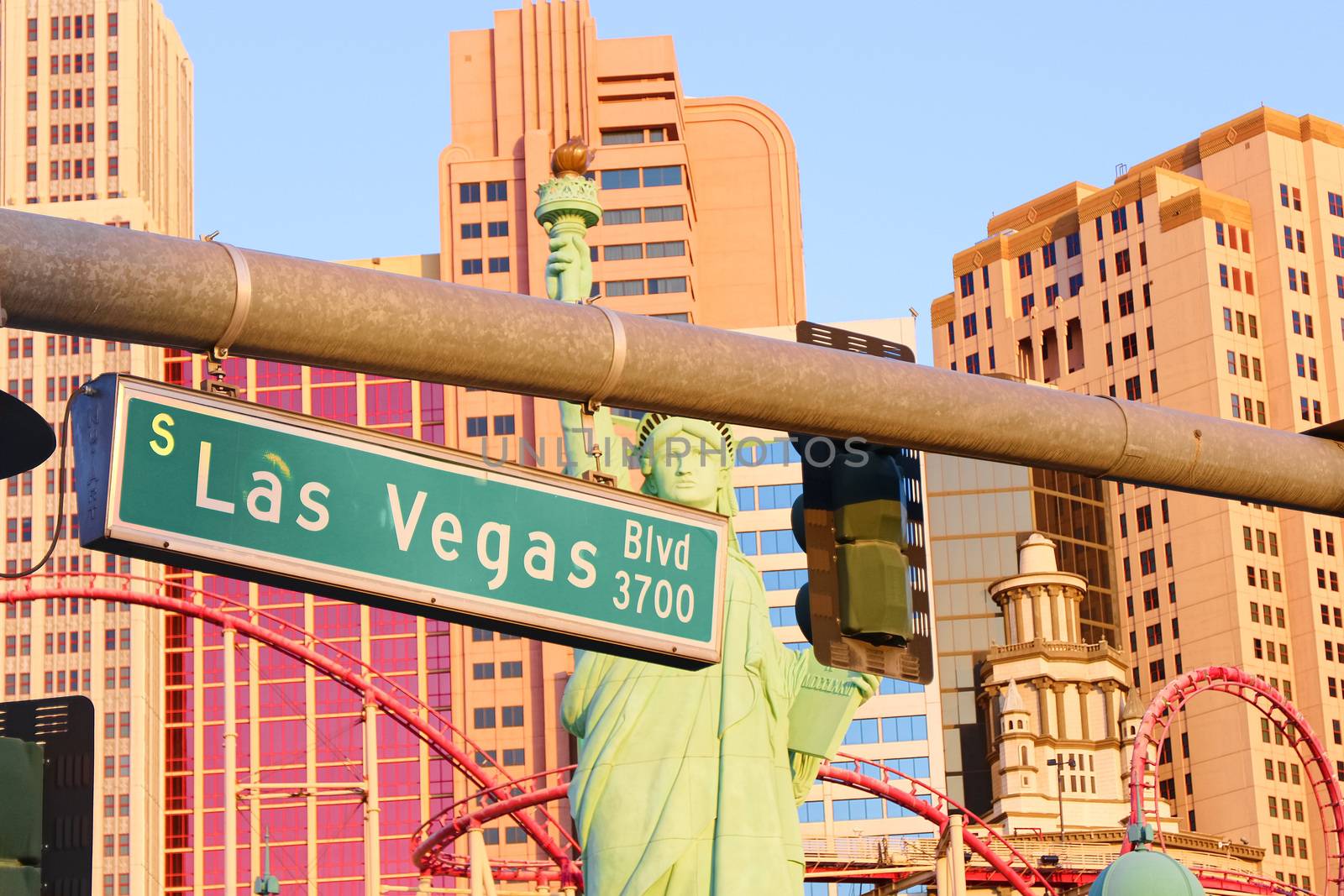 Road sign of Las Vegas BLVD.Street sign of Las vegas Boulevard.Green Las Vegas Sign with Hotel in Background. by USA-TARO